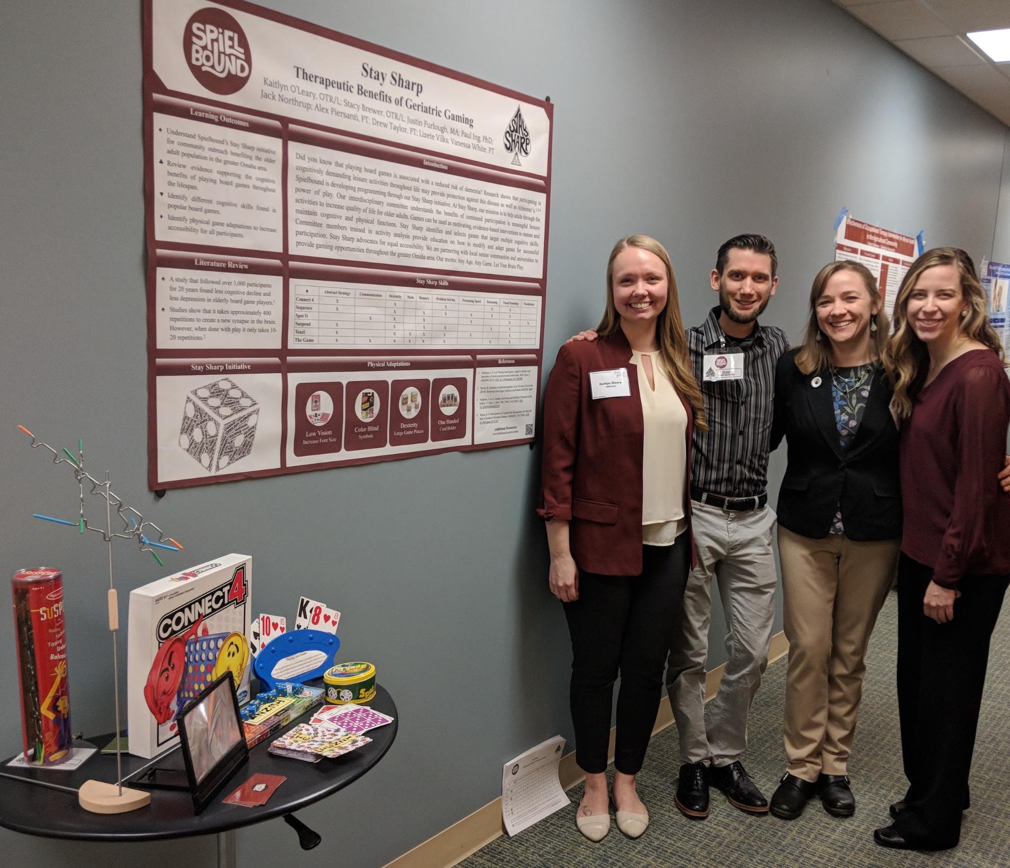 The Stay Sharp Crew in front of the their poster at the Nebraska Occupational Therapy Asssociation Conference.